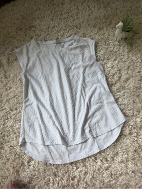 White Elle flowy white t shirt like cute women’s top with polka dots.